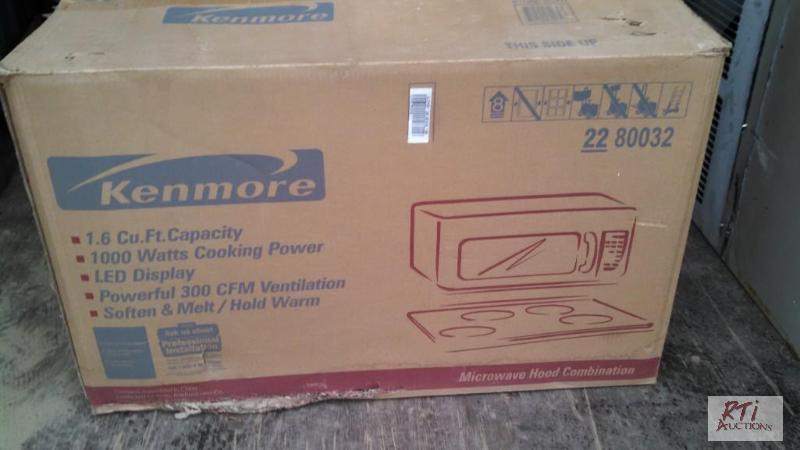 lot 53 image: New never used Kenmore 1000W microwave. Desig...