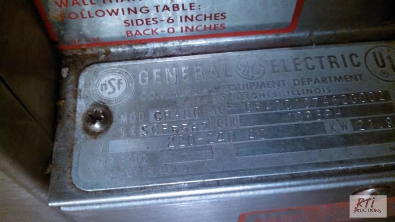 lot 55 image: GE electric commercial stove. Extra set of re...