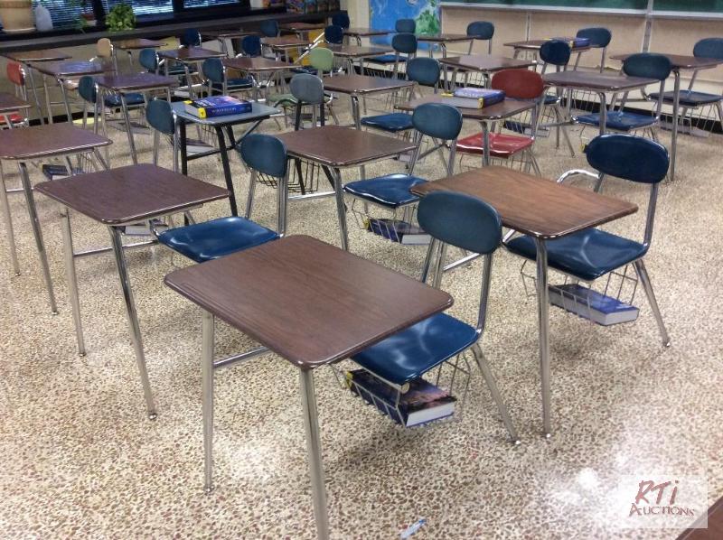 lot 67 image: (100) One piece student desks with connected ...