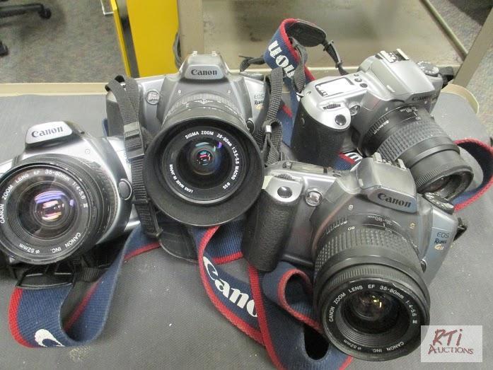 lot 87 image: (4) Canon G11 35mm cameras, condition unknown...