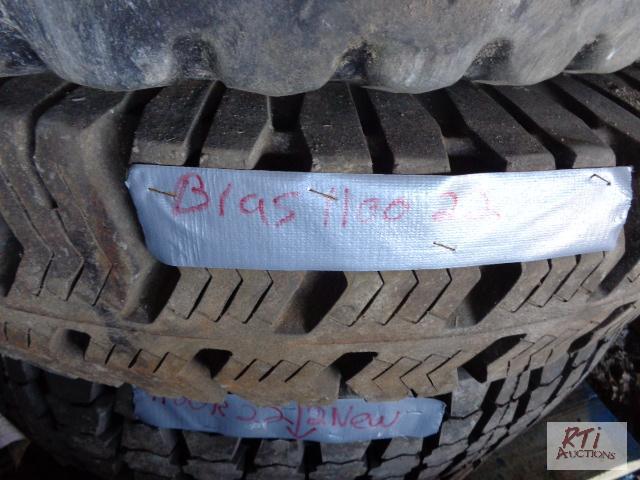 lot 56 image: (1) 11.00-22 Bias Truck Tire, (2) 11R22 (Unus...