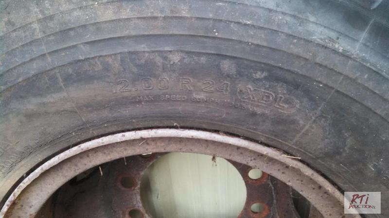 lot 58 image: (2) Michelin 12Rx24 used drive tires mounted ...