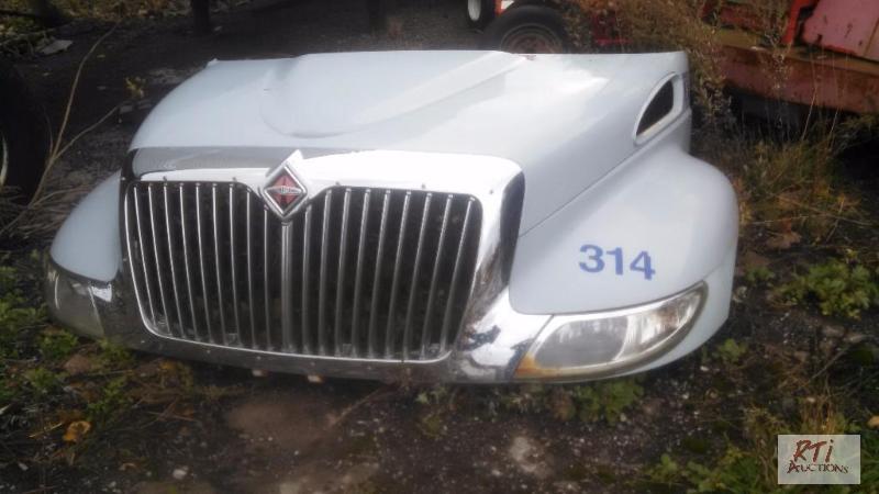 lot 49 image: International 3200 Series hood. Inner fenders...