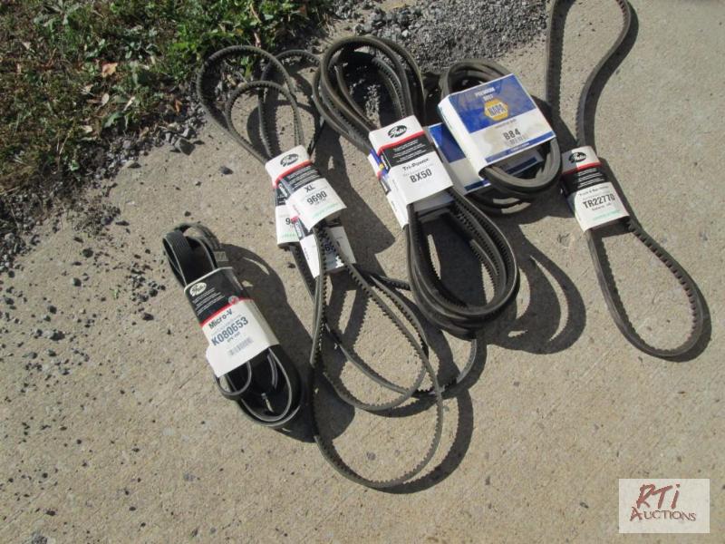 lot 57 image: Box of misc. belts. All equipment sells AS IS...