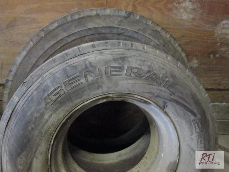 lot 37 image: One new and one used tire, 11R22.5 on rim, 11...
