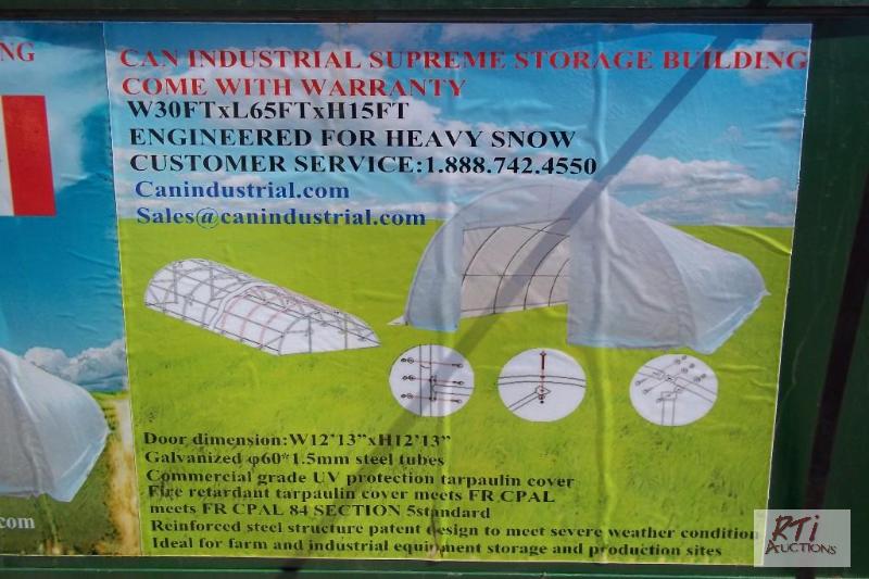 lot 113 image: 30X65X15 storage building, new in box. Locate...