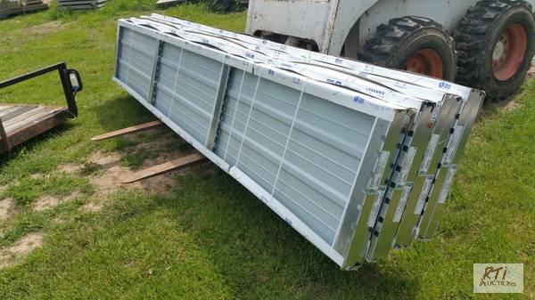 lot 162 image: (8) 2X12 commercial garage door sections. T...