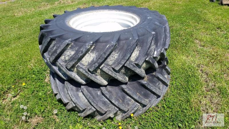 lot 66 image: (2) Continental 18.4R30 tires and rims. Cente...