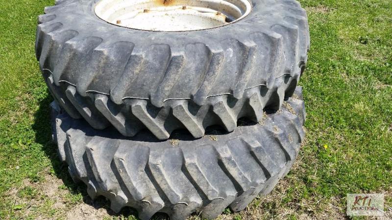 lot 68 image: (2) Firestone 18.4R34 tires and rims. Centers...