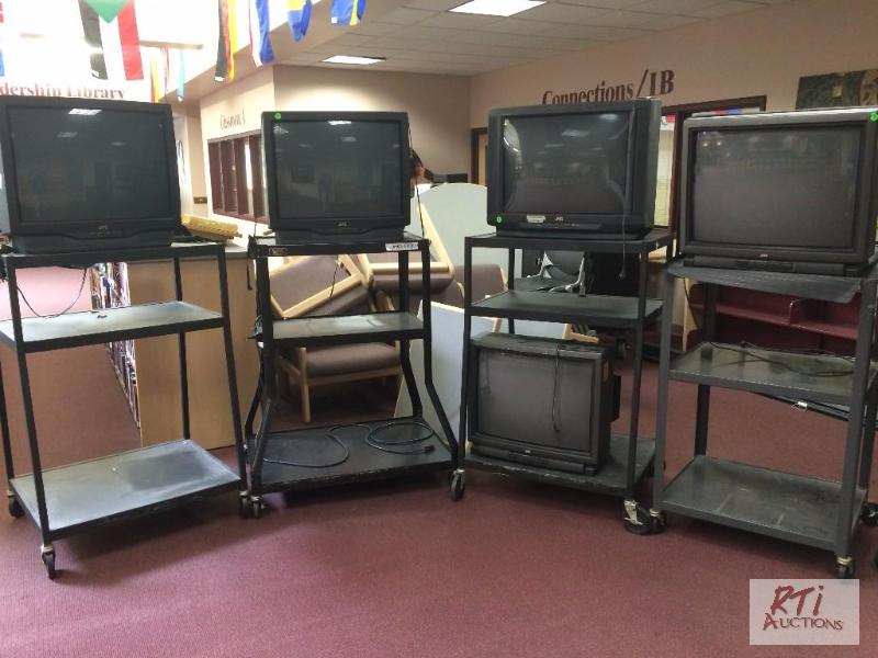 lot 54 image: Quantity of 11 JVC TVs with 10 carts, model A...