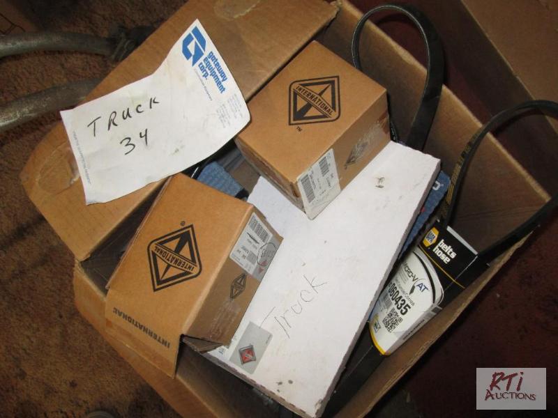lot 59 image: Box of parts for IH truck, belts, filters. Al...