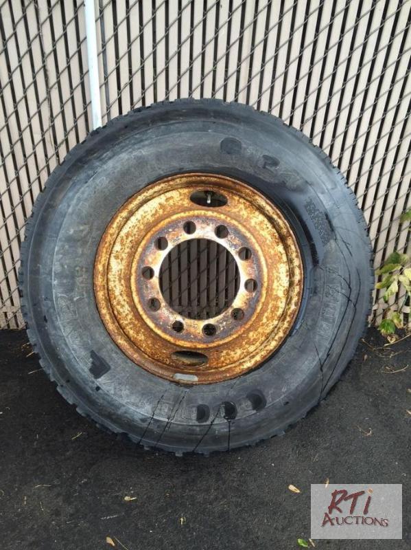 lot 89 image: Goodyear 11R22.5 tire and rim, in fair condit...