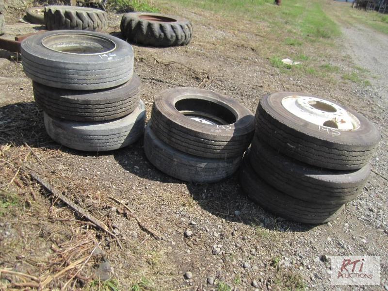 lot 145 image: (7) 25570R22.5 tires mounted on 10-hole rims...