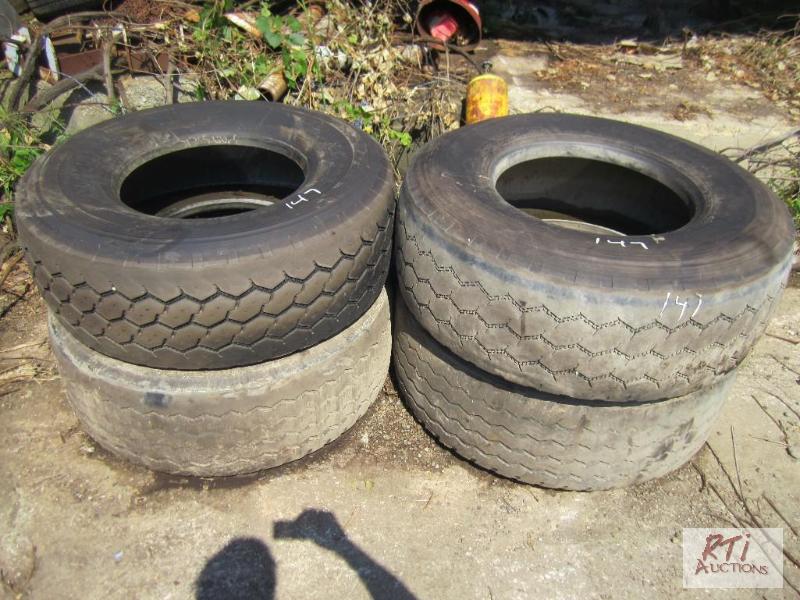 lot 147 image: (4) 42565R22.5 tires - (1) mounted on an ope...