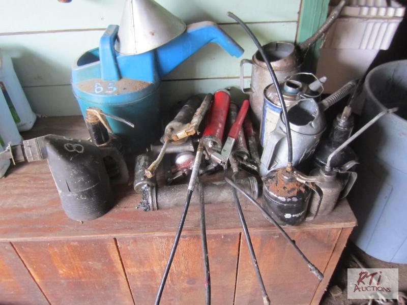 lot 85 image: Grease guns and oil cans...