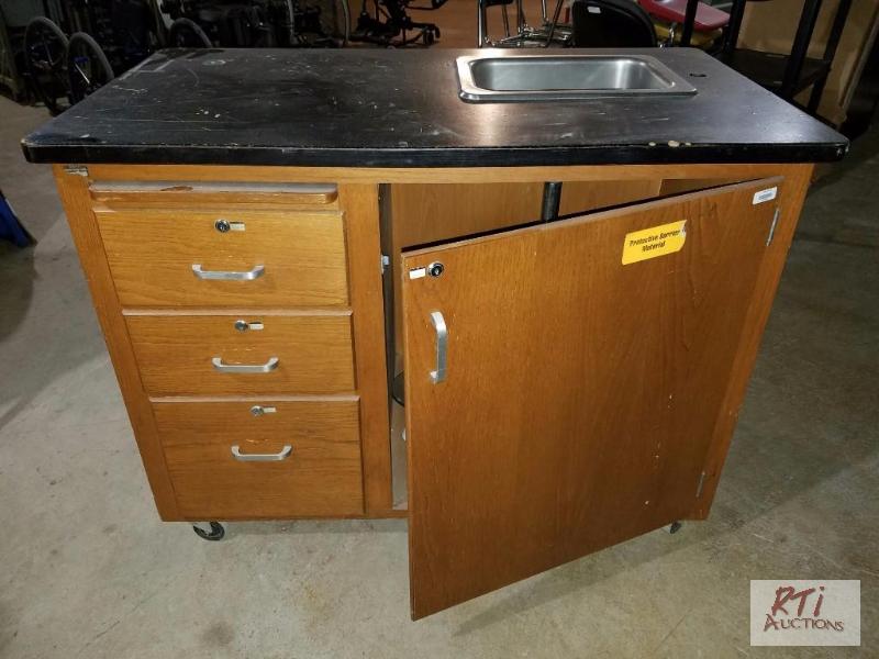lot 103 image: Science cabinet with sink, approximately 4 ft...