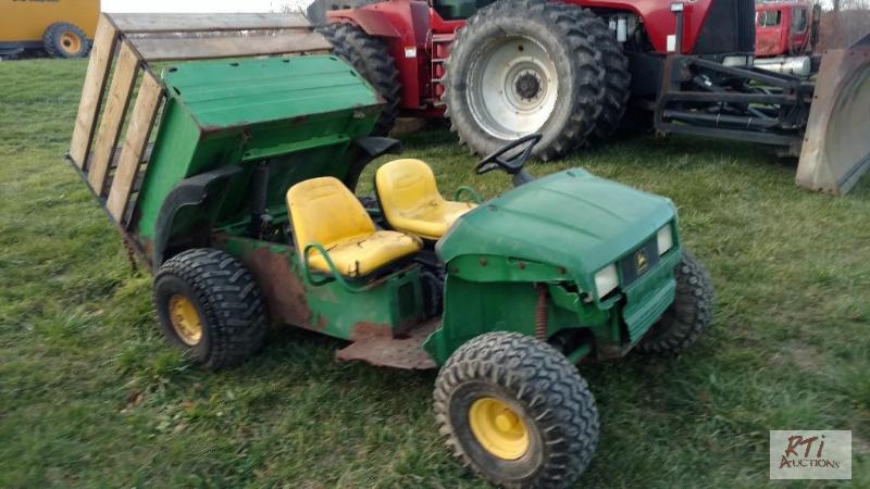 lot 69 image: JD Gator 2x4. Kawasaki Gas Engine. Dump box. ...