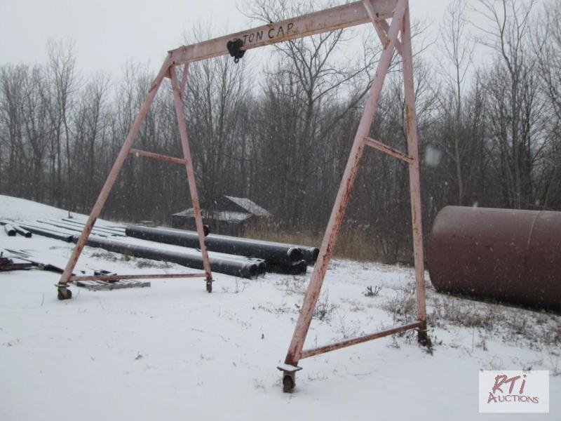 lot 101 image: A frame for lifting, on steel casters,12 foot...